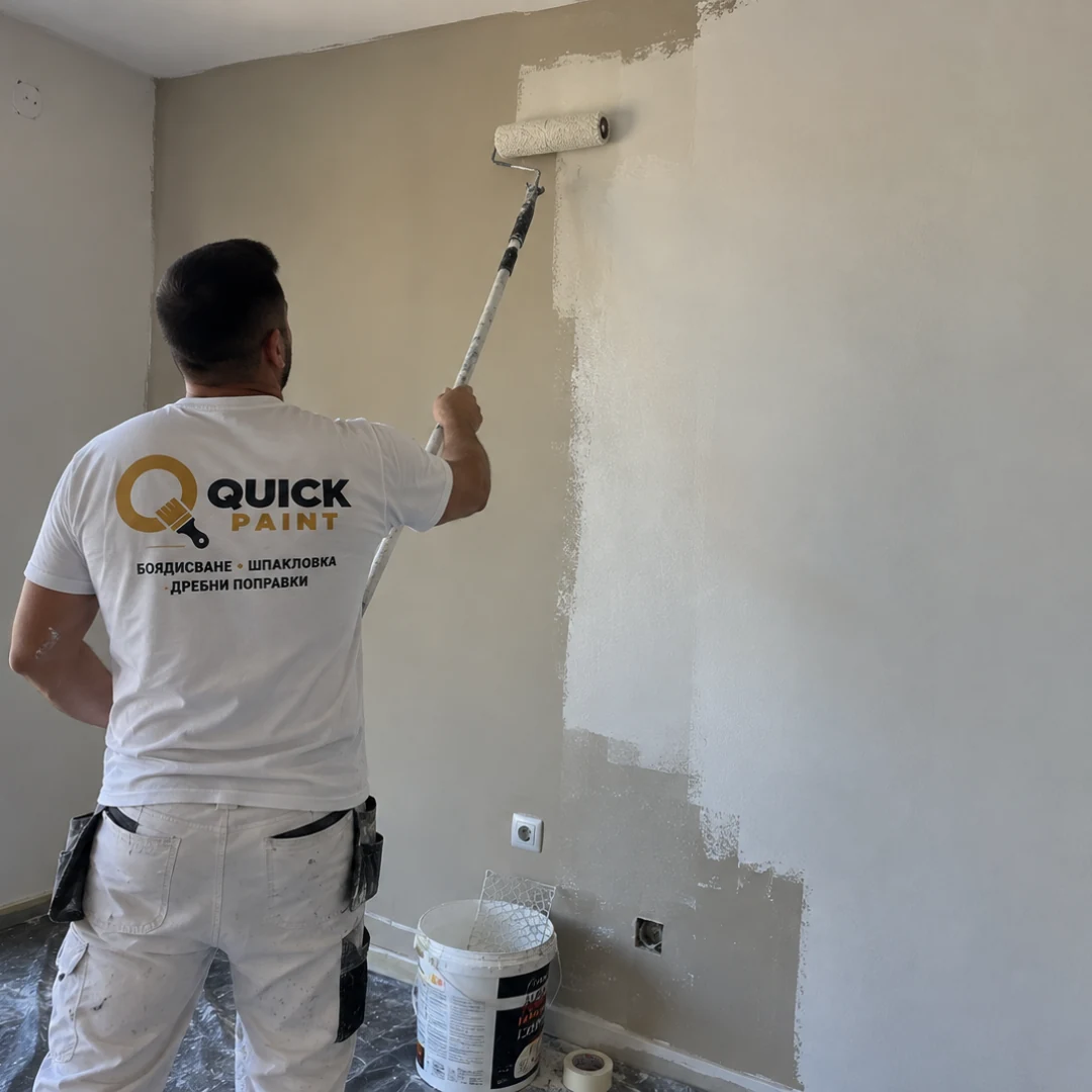 Quick Paint worker painting an interior wall